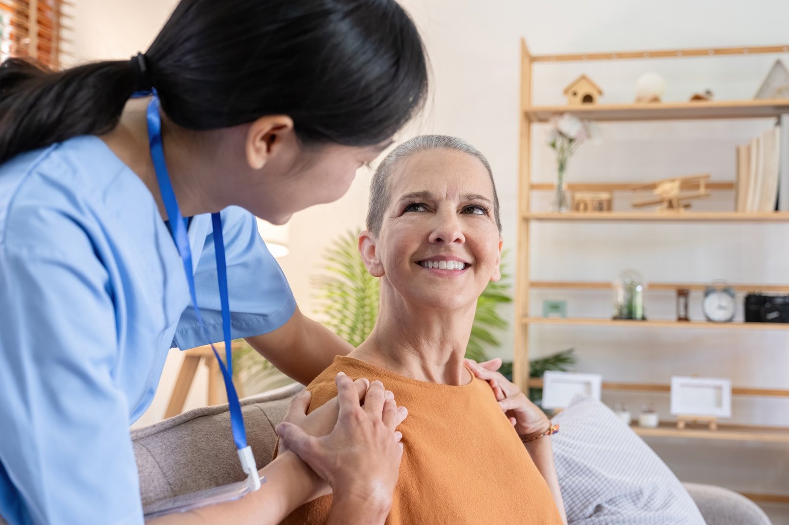 Caregiver Assisting Elderly Woman with Health and Well-being at Home, Smiling and Engaging in a